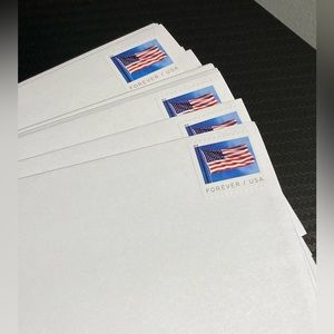 25 Envelopes with stamps, size #10 white color, peel and seal.